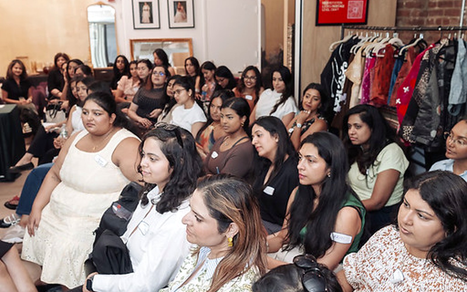 A room of South Asian women seated in rows watching a panel at the Brown Girl Angels New York Tech Week event