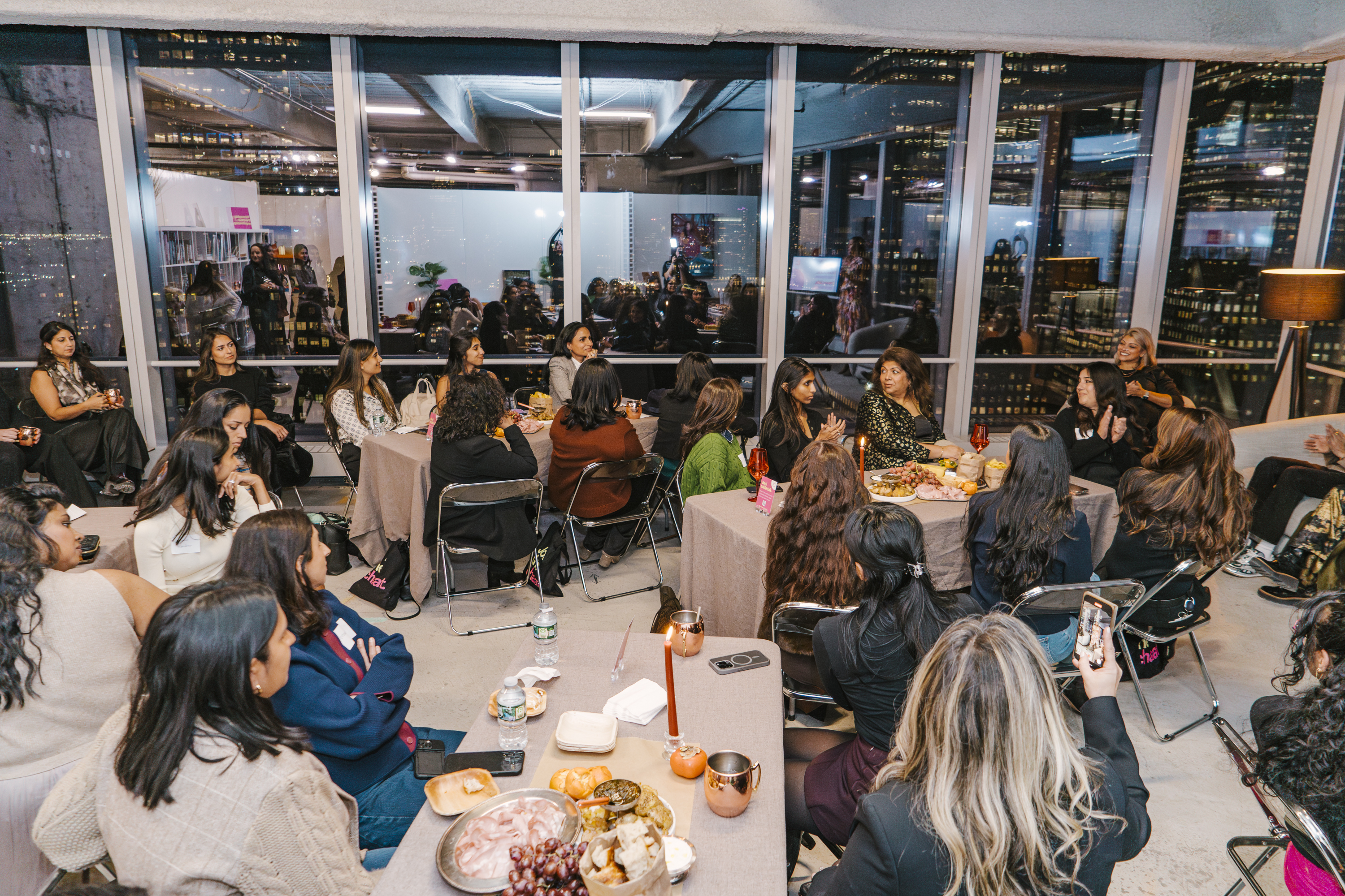 A wide shot of the Brown Girl Angels SickKids fundraiser in New York &mdash; the full room, the skyline, the community.