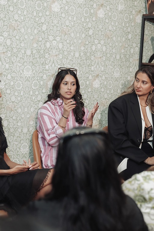 A founder mid-conversation at Brown Girls Pitch the Collective during NYC Tech Week — founders supporting founders.